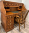 Antique desk with wooden roll top