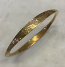 Hammered gold bracelet.