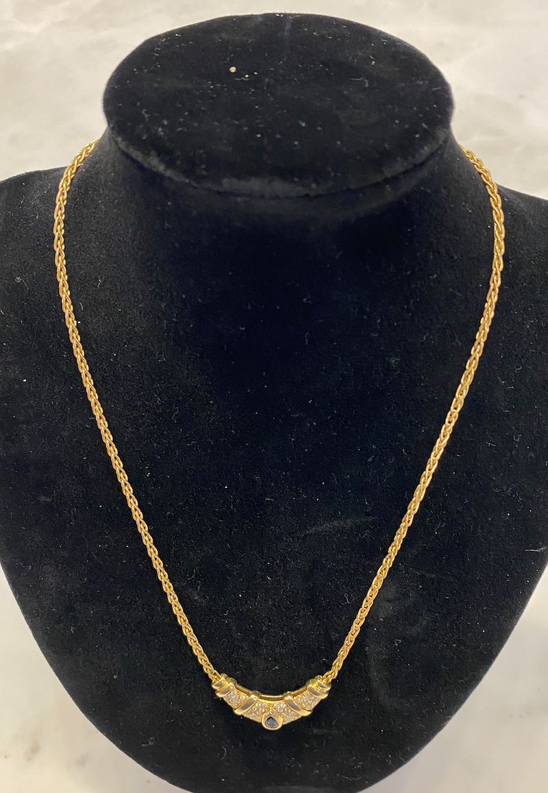 Gold necklace with stone and diamonds.